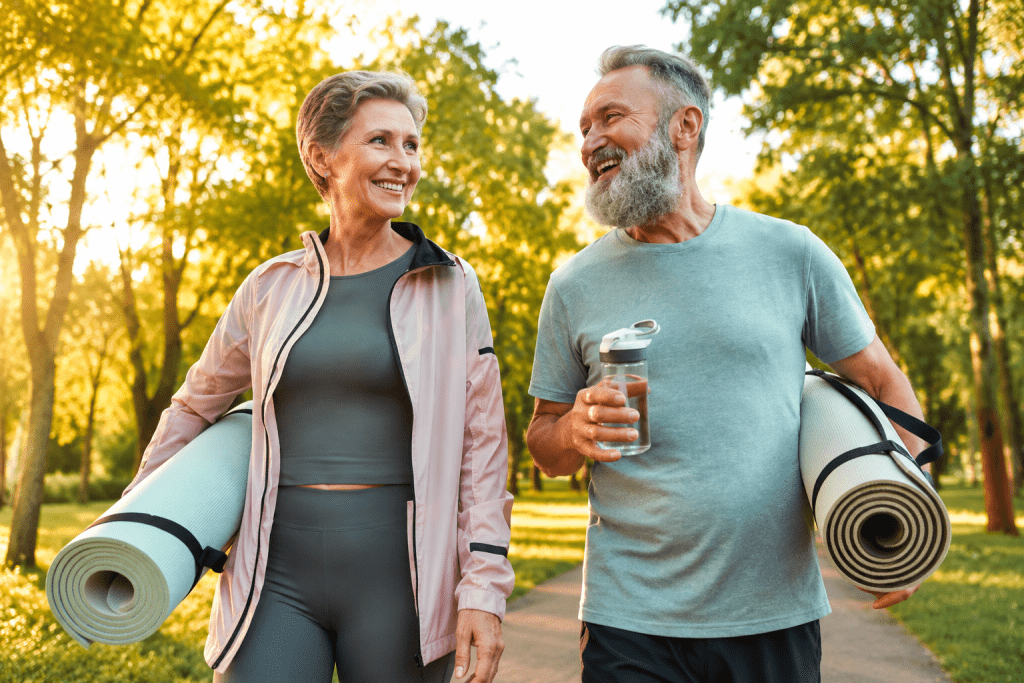 Signs You Need Hormone Replacement Therapy in active older couple outdoors.
